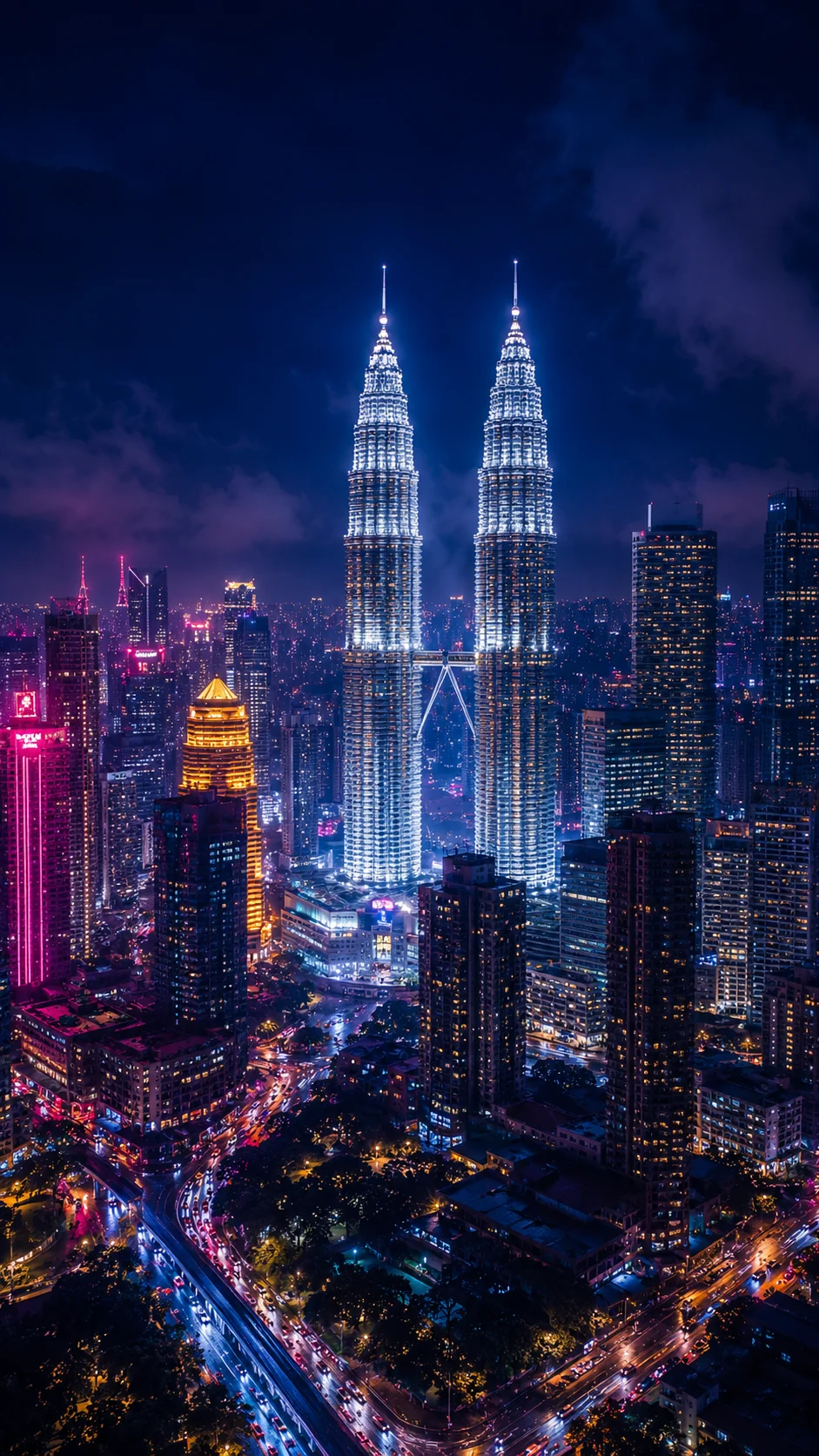 Petronas Towers glowing over Kuala Lumpur night skyline